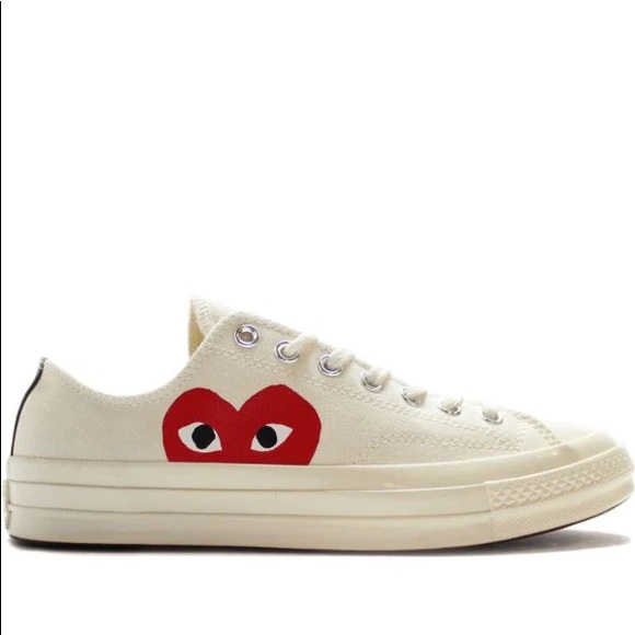 CDG white low top converse. Women’s 7, men’s 5.